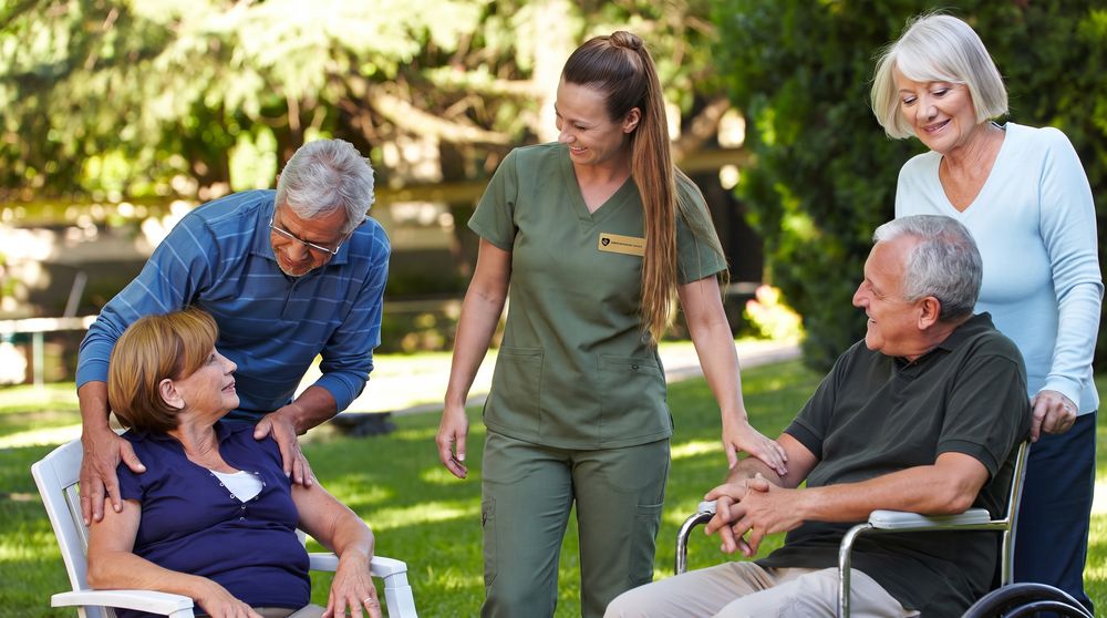 A family together outdoors, able to rest because care is covered